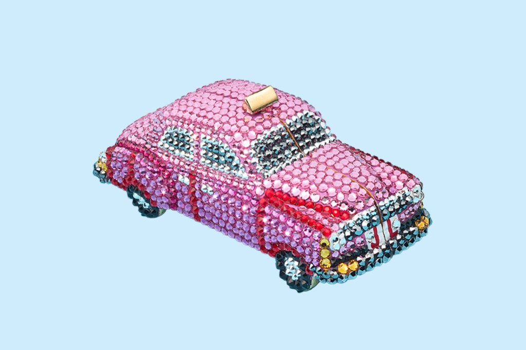 A pink car covered in fake rocks